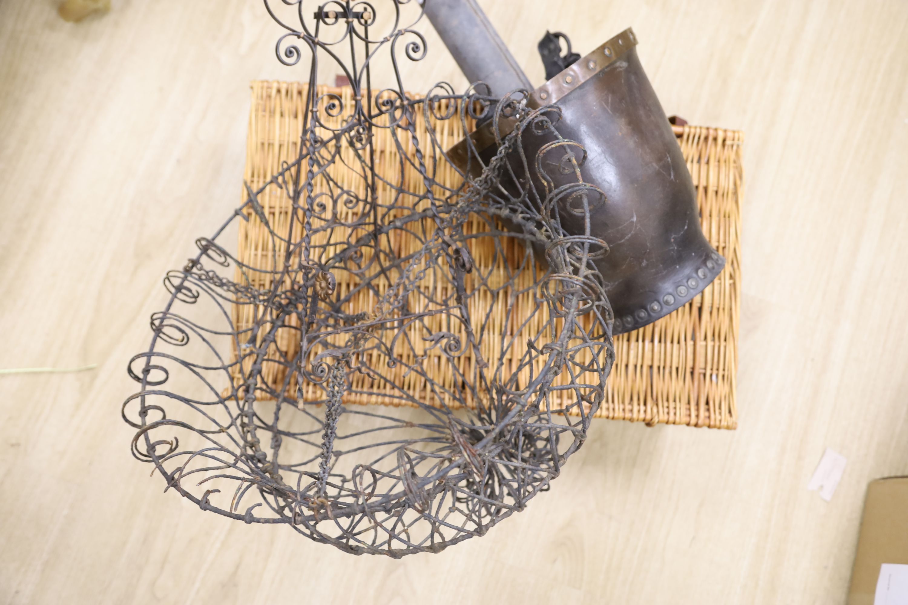 A wirework hanging basket, a fire bucket, a telescope, an easel and a picnic basket